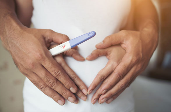 Family checking a pregnancy test