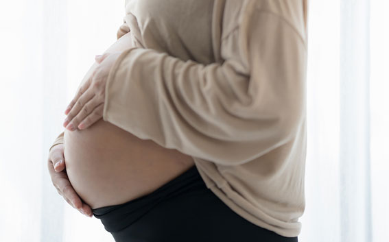 Obstetrician speaking with an expectant mother during an antenatal visit