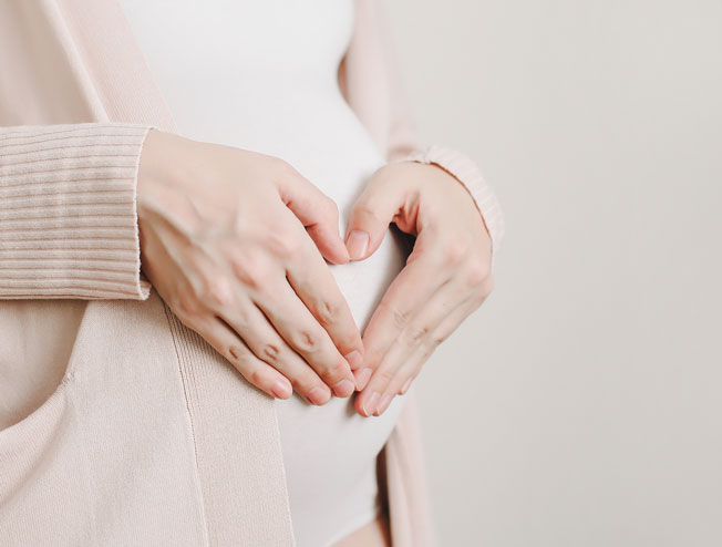 Pregnant woman receiving obstetric care consultation